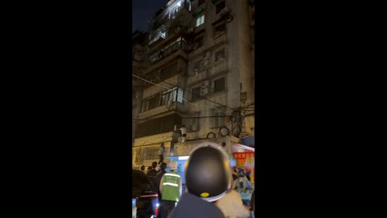 Child rescued from building window grill in Shanghai, China