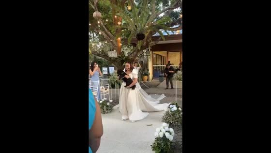 Bride chooses pup over bouquet in heartwarming aisle walk