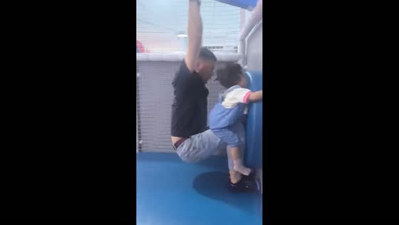 Father and daughter share fun zip line ride in Liaoning, China