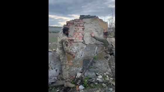 Soldiers rush for cover mid-video as shelling begins in Kharkiv, Ukraine
