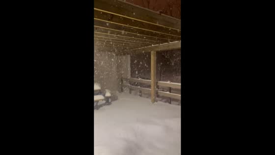 Heavy snowfall blankets roads and landscape in Beachwood, USA