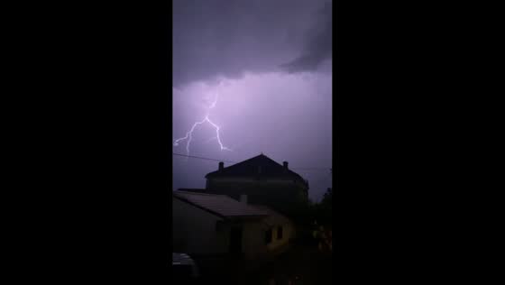 Spectacular lightning branches across night sky over Portets, France