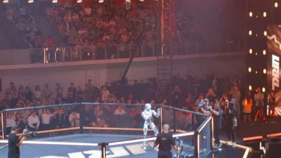 Two humanoid robots fight inside arena in Shenzhen, Guangdong, China