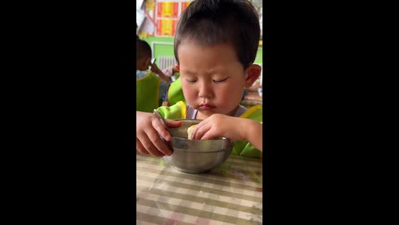 Sleepy boy startles himself after falling asleep in classroom in Shaanxi, China