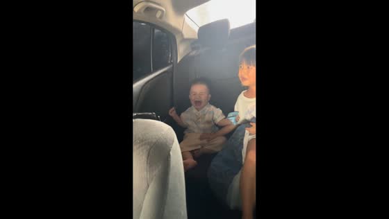 Children frightened and crying during automatic car wash in Guangdong, China