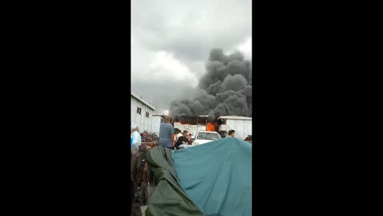 Massive building fire sends thick black smoke into the sky in Guangzhou, China