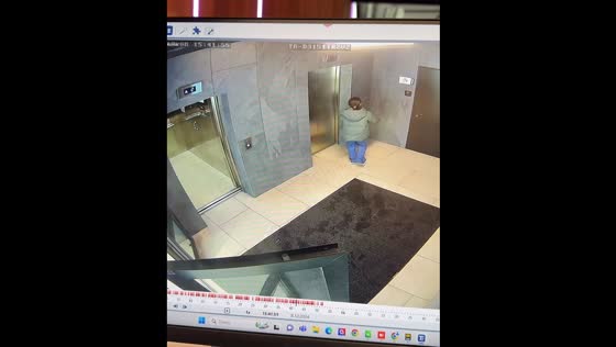 Girl struggles to catch both elevators in Moscow