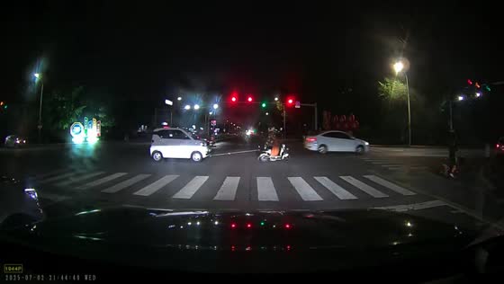 Man pushes electric bicycle towing small vehicle in Shandong, China