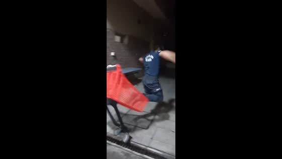 Firefighter colleagues playing with a cart in Avellaneda, Buenos Aires, Argentina