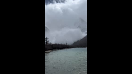 Avalanche rushes down mountain near Daocheng Yading in Sichuan, China