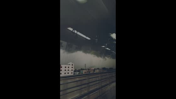Dark storm clouds turn afternoon sky gloomy in Bangalore, India