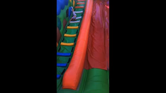 Child flips and falls inside inflatable slide in Minsk, Belarus