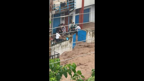 Powerful muddy floodwater surges past homes in Himachal Pradesh, India