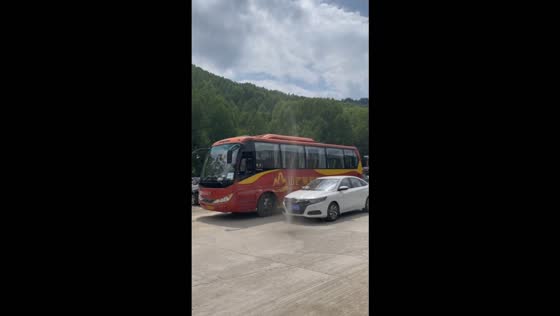 Dust devil forms in a parking lot near parked cars at Wutai Mountain, Shanxi, China
