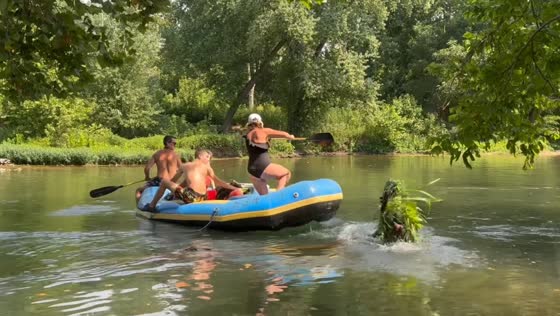 Prankster pretending to be a bush startles raft on Niangua River, Lebanon, Missouri