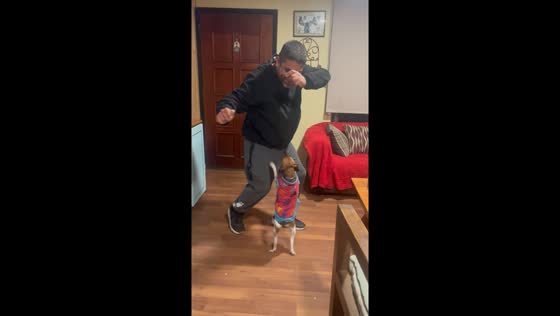 Man and dog dance together in Limache, Chile