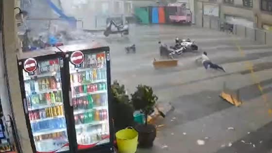 Strong wind blows person off balance in Wansheng