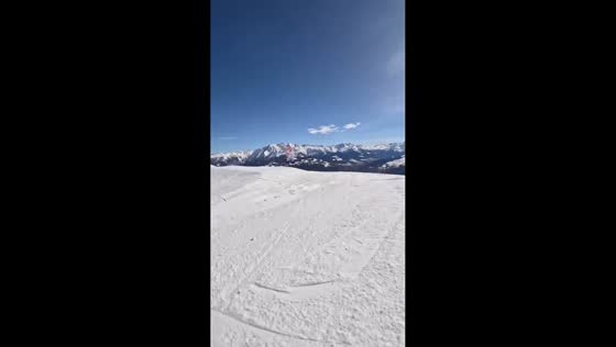 Supportive parenting helps young skier overcome a fall in Laax, Switzerland
