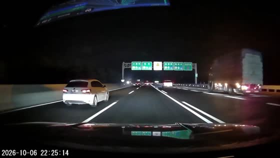 A pedestrian walking in the middle of a highway startles drivers at night in Henan, China