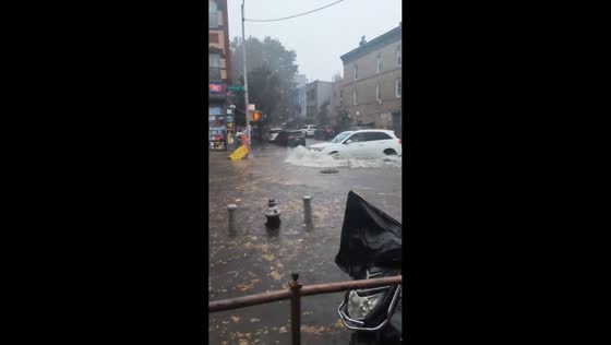 Floodwaters during heavy rain in Bushwick, New York, USA