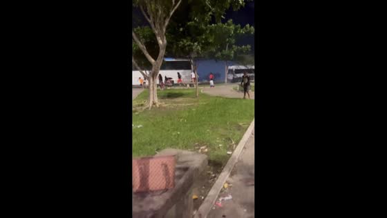 Child playfully misfires roman candle firework in Manaus, Brazil