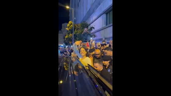 Rosalía waves to fans after surprise album announcement in Callao, Madrid, Spain