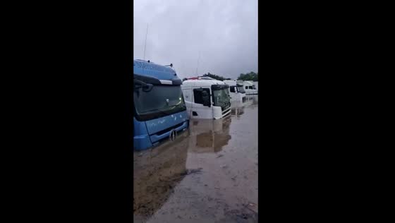 Severe flooding submerges trucks at Rio de Janeiro service Station