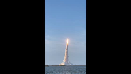 Artemis II rocket launch filmed from causeway near Titusville, Florida, USA