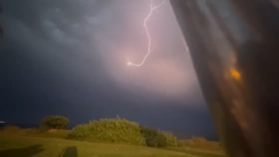 Powerful lightning bolt illuminates night sky over Torrevieja, Spain