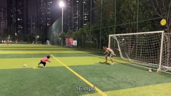 Toddler slips while trying to kick football in Guangdong, China