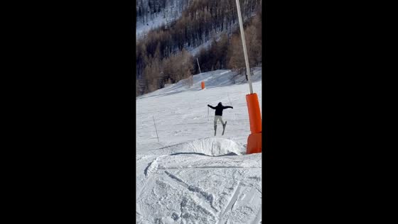 Skier falls after small jump in Auron, France