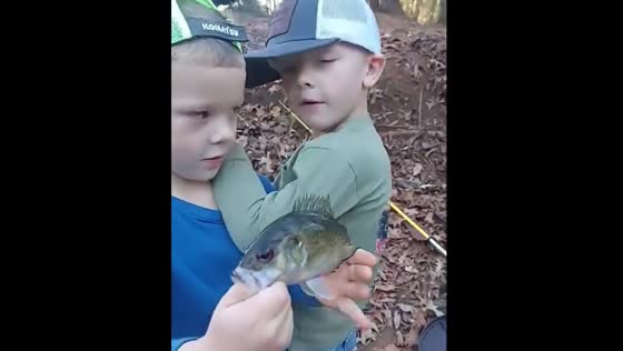 Twins joke after catching a fish in Alabama