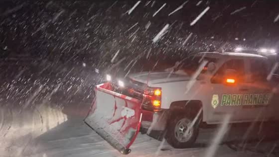 Rockslide rescue: snow plow clears Highway 74 during heavy snowfall in Evergreen, Colorado