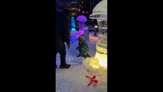 Boy accidentally knocks over ice sculpture during snowy outing in Vail, Colorado, USA