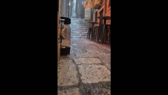 Heavy rain floods historic stone streets and stairways in Dubrovnik, Croatia