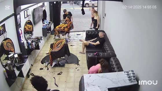 Man accidentally shatters barbershop glass door in Buenos Aires, Argentina