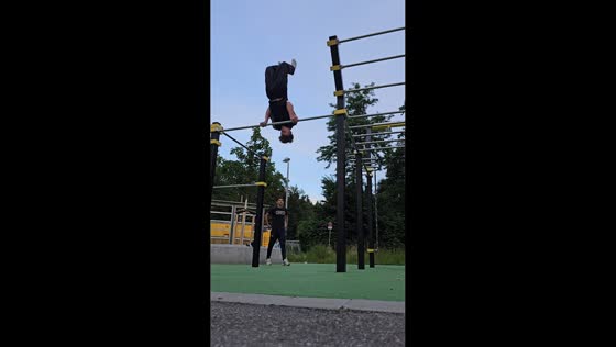 Calisthenics athlete loses grip and falls during bar routine in Freiburg im Breisgau, Germany