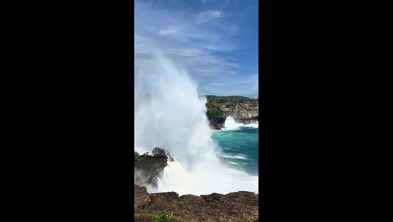 Large ocean wave crashes against cliff in Shanghai, China