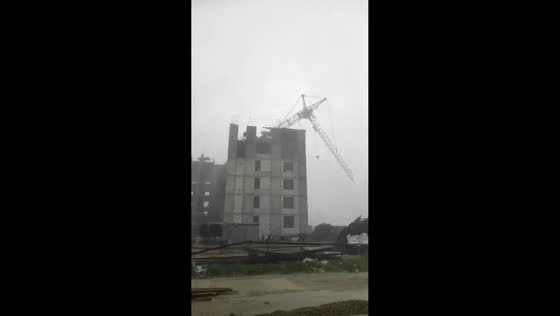 Strong winds cause tower crane to collapse at construction site in Yevpatoria, Russia