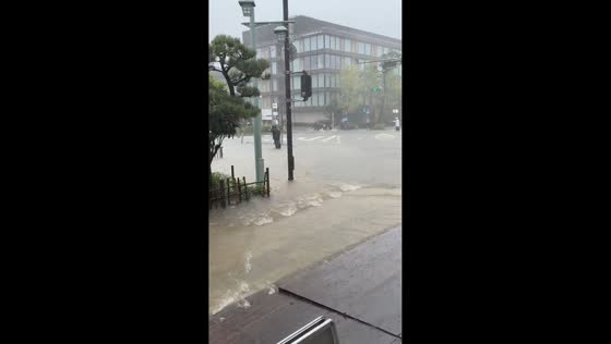 Torrential rain floods streets and intersections during Typhoon Dujuan in Kamakura, Japan