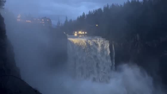 Massive water flow at Snoqualmie Falls during river storm, Washington, USA