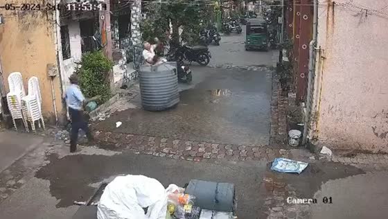 Woman escapes injury as empty water tank falls from roof in Gujarat, India