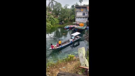 Childhood adventure takes a splash: playful boat maneuvers in East Kalimantan, Indonesia