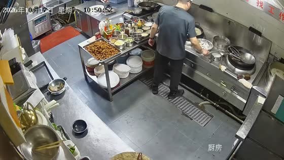 Spatula explodes while a cook prepares food in a kitchen in Henan, China