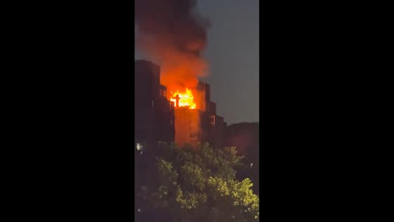 Intense fire engulfs upper section of residential building in Chongqing, China