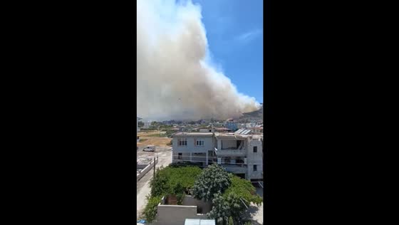 Thick smoke covers burning mountain in Antakya, Turkey