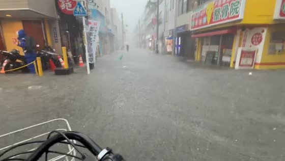Severe flooding hits Togoshi Ginza shopping street in Shinagawa, Japan