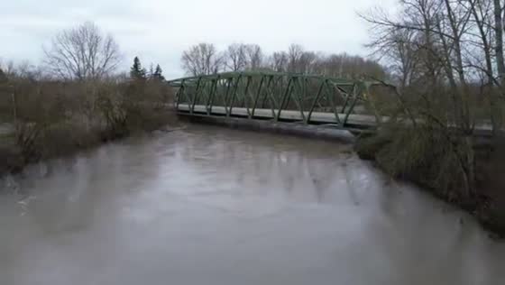 Nooksack River swells with fast floodwaters along SR 539 in Lynden, USA
