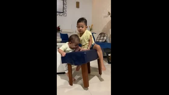 Chair mishap: toddlers' tumble caught on camera
