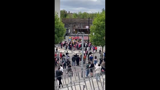 Arsenal fans flood Emirates Stadium area after historic title win in North London, England, UK